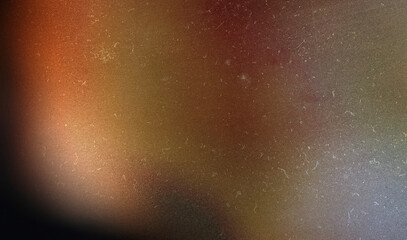 grainy colorful warm orange light leaks on black background with dust texture. abstract damaged...
