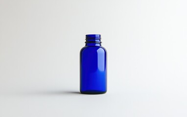 Naklejka premium Cobalt Blue Glass Bottle on White Background