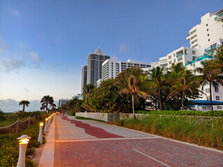 Miami Beach Boardwalk at early morning with vibrant landscaping and buildings
