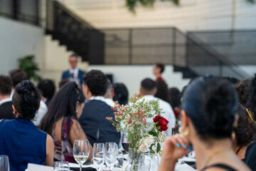 people watching at an event inside