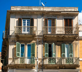 Green and Brown Shutters in Messina Italy
