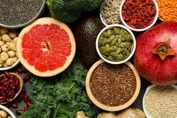 Superfood. Different healthy food products on grey table, flat lay
