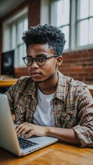 African American student using a laptop.