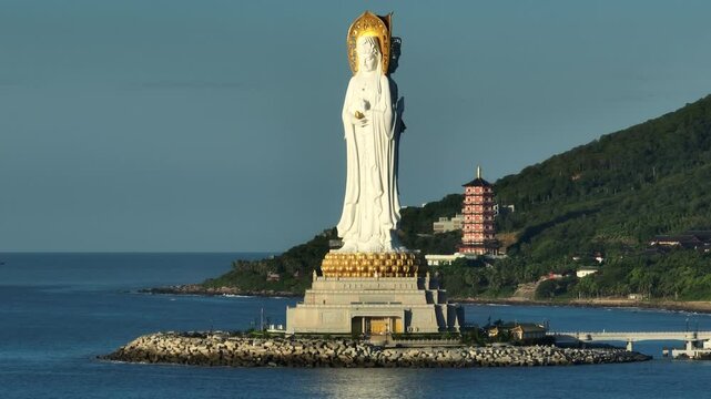Buddhism Guanyin statue at seaside in nanshan temple, hainan island , China, words mean blessing and mercy