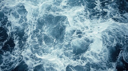 Obraz premium Turbulent ocean waves crashing and swirling, creating a dynamic marine scene with foam