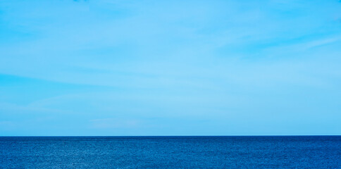 Nature of the beach and sea Summer with sunshine, sandy beaches, clear blue waters sparkling against the blue sky. On an island with good ecology and environment Background for summer vacation