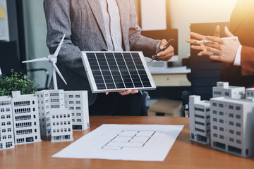 Discussion among businesspeople on the latest developments in solar cell panel technology and Solar...