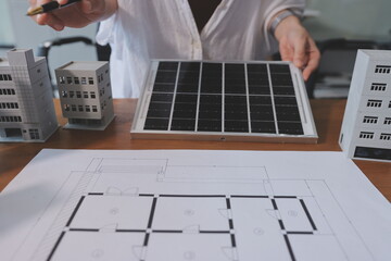 Discussion among businesspeople on the latest developments in solar cell panel technology and Solar...