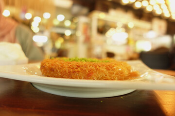 Delicious turkish kunefe dessert on a table 