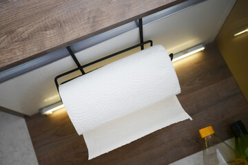 Practical kitchen setup with a paper towel holder in view