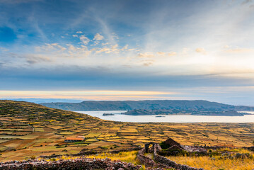 View of the island from Amantani Island at sunset in Puno Peru © JuanLuis