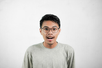 Asian man showing an expression of surprise and shock