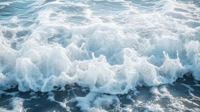 A closeup photograph shows waves of foamy ocean water - Powered by Adobe