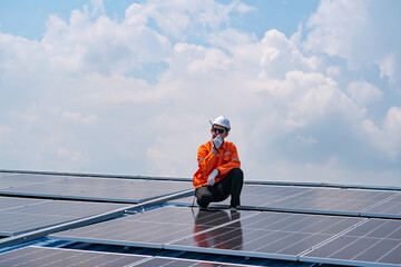 Male Engineer service check installation solar cell on the roof of factory and Communicate with ground engineer team , Renewable energy solution for climate change Concept