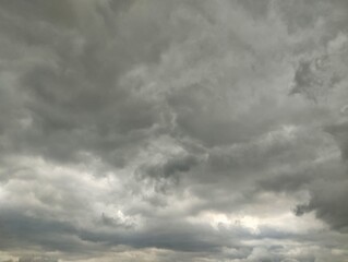 Obraz premium Dramatic dark clouds overcast sky filled with dense clouds and Strom timelapse 