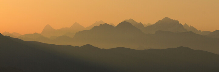Stunning sunrise view from a place near Gstaad, Switzerland. Mountain ranges in the Bernese...