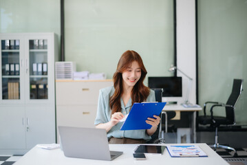 Obraz premium female office businesswoman startup daydreaming about her work, startup and working with laptop on office desk