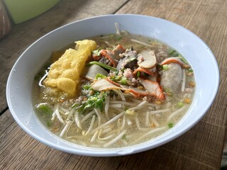noodles with pork and vegetables on table