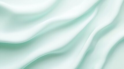 Abstract flowing silk fabric background with soft light minty green tones