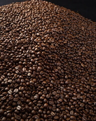 A steaming cup of coffee surrounded by scattered coffee beans.