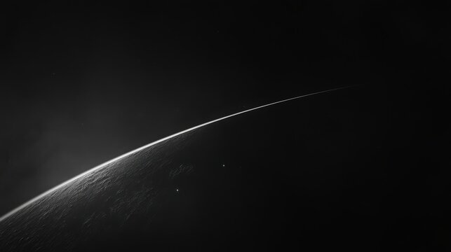 Dramatic monochrome planet horizon with atmospheric glow and stars