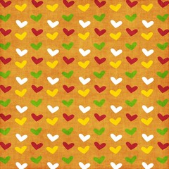 Seamless colorful heart pattern on warm orange background with red, yellow, green and white hearts, cute romantic design ideal for Valentine’s Day, kids decor, textiles and gift wrap.