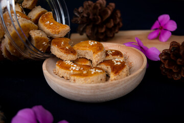 Closeup view of Peanut cookies, a type of dry cookie made from peanuts in various shapes, usually served on holidays, such as Eid al-Fitr, Christmas, and Chinese New Year.