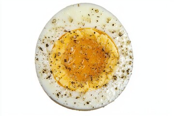 Delicious boiled egg sprinkled with pepper on clean white background a simple and tasty breakfast dish