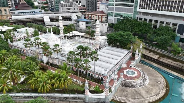 Drone shot of Masjid Jamek Mosque and River of Life in Kuala Lumpur, Malaysia.