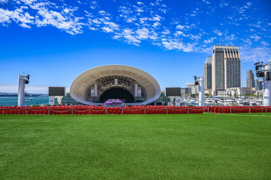 2023-12-31 VIEW OF THE RANY SHELL WITH ITS RED CONCERT SEATS GREEN LAWN AND A VIEW OF THE SAN DIEGO SKYLINE WITH A NICE BLUE SKY