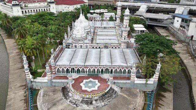 Drone shot of Masjid Jamek Mosque and River of Life in Kuala Lumpur, Malaysia.