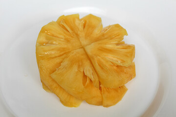 Cut pineapple flesh, isolated on white background