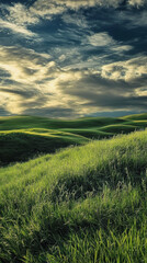 Rolling green hills under a dramatic cloudy sky