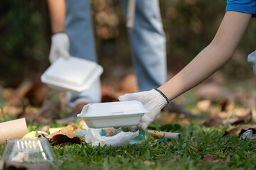 Volunteer picking up trash during a community cleanup event