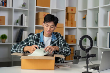 Unpacking trendy footwear from a box, preparing for a live demonstration.