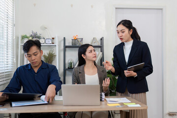 Team brainstorming solutions in a modern office, highlighting collaboration and communication.