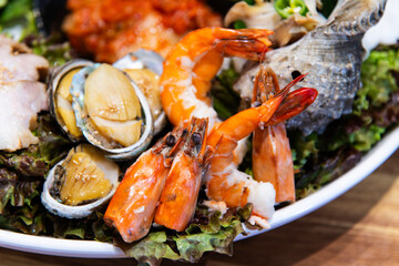 steamed abalone, prawn and boiled pork with other ingredients on the dish