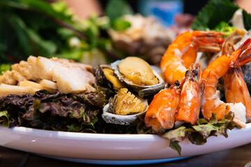 steamed abalone, prawn and boiled pork with other ingredients on the dish