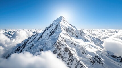 Naklejka premium Snow-Capped Mountain Peak Above Clouds with Blue Sky Background