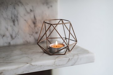 A lit tealight candle sits inside a rose gold geometric wire candle holder placed on a marble shelf. The scene is minimalist and evokes a feeling of calm and relaxation.