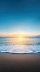 Obraz premium A beautiful beach scene with a calm ocean and a beautiful sunset