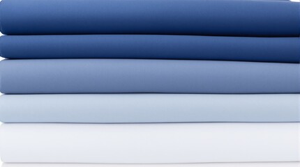 Fototapeta premium A stack of folded fabric in shades of blue and white placed against a plain white background. Smooth texture with a gradient arrangement, concept of textiles. Ai generative