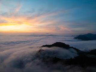 Drone aerial view of landscape fog over mountains in sunrise sky,High angle view over countryside at Southeast asia,Phang Nga Thailand,Wide angle view nature landscape