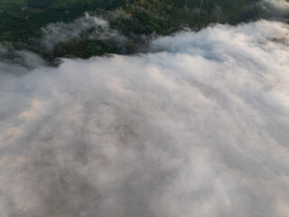 Drone aerial view of landscape fog over mountains in sunrise sky,High angle view over countryside at Southeast asia,Phang Nga Thailand,Wide angle view nature landscape