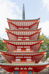 Fujiyoshida, Yamanashi, Japan - APR 17, 2024: Arakura Fuji Sengen Jinja Shrine. Mt Fuji with red pagoda in cherry blossom sakura in spring season .