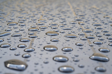 Raindrops On Smooth Metal Surface Forming Waterproof Hydrophobic Effect Macro Closeup With High Detail Perfect For Abstract Background Water Resistance Technology And Liquid Droplets Reflection