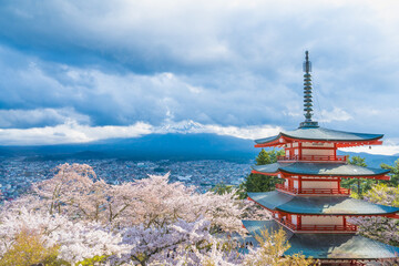 Fujiyoshida, Yamanashi, Japan - APR 17, 2024: Arakura Fuji Sengen Jinja Shrine. Mt Fuji with red pagoda in cherry blossom sakura in spring season .