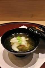 Japanese cuisine: icefish soup with mozuku seaweed and namafu (wheat gluten) in Tokyo, Japan