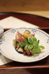 Japanese cuisine: firefly squid with razor clams and burdock in Tokyo, Japan