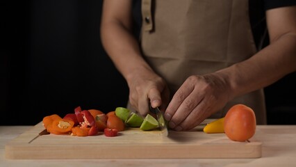 Chopping fresh vegetables in a home kitchen culinary preparation indoor environment close-up view healthy cooking concept